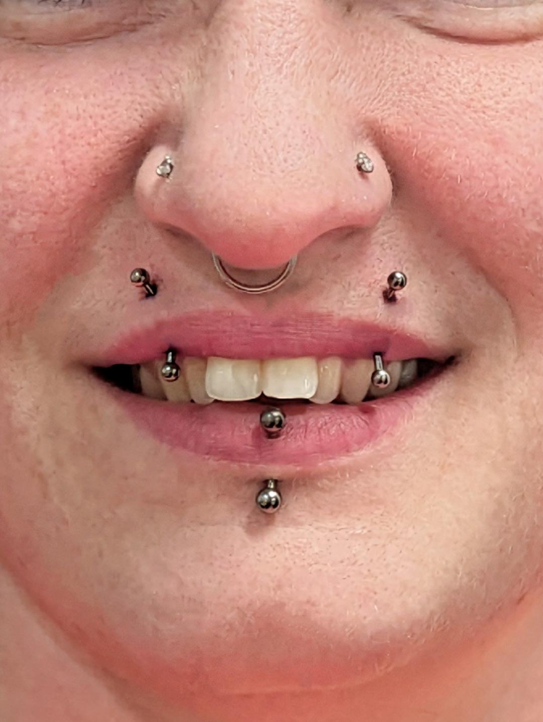 Vertical angel bites facial piercing